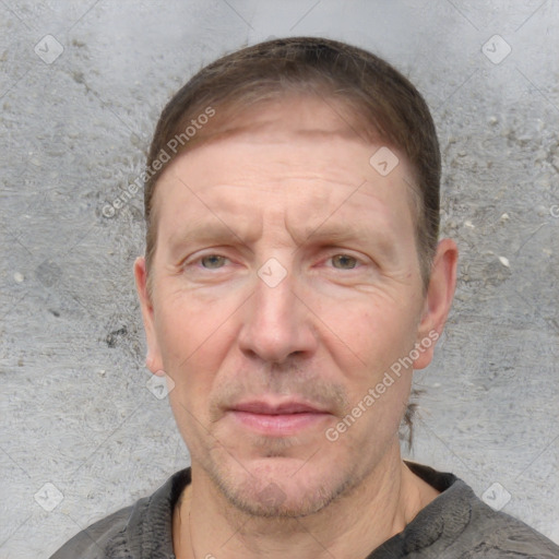 Joyful white adult male with short  brown hair and grey eyes