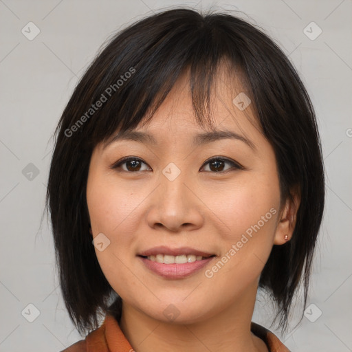 Joyful asian young-adult female with medium  brown hair and brown eyes