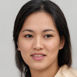 Joyful asian young-adult female with medium  brown hair and brown eyes