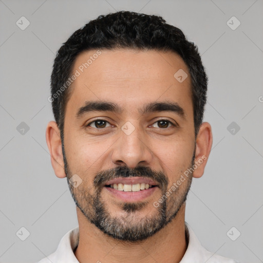 Joyful latino young-adult male with short  black hair and brown eyes