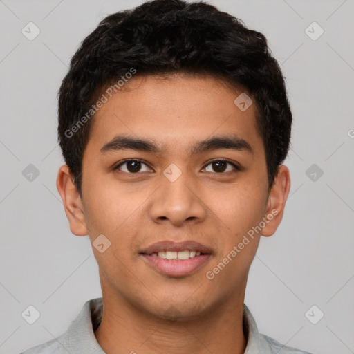 Joyful latino young-adult male with short  black hair and brown eyes