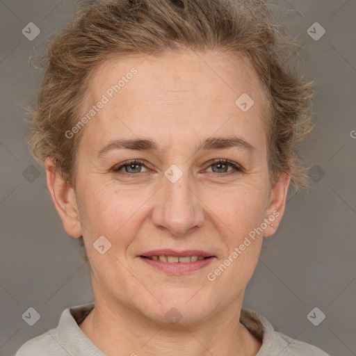 Joyful white adult female with short  brown hair and brown eyes