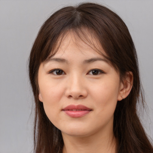 Neutral asian young-adult female with long  brown hair and brown eyes