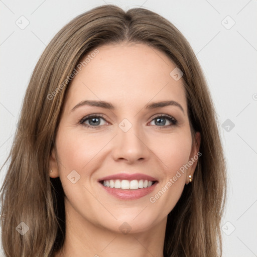 Joyful white young-adult female with long  brown hair and green eyes