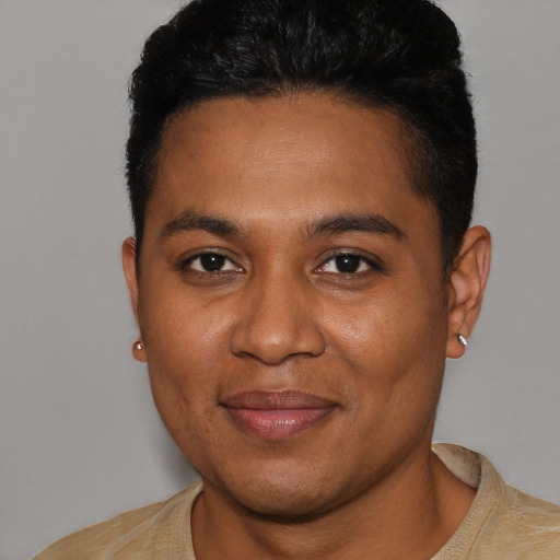 Joyful black young-adult male with short  brown hair and brown eyes