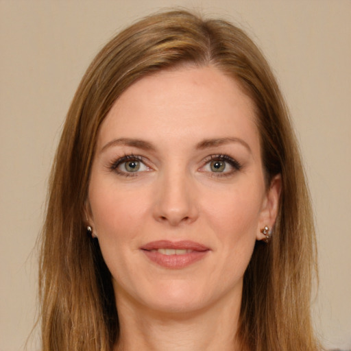 Joyful white young-adult female with long  brown hair and green eyes