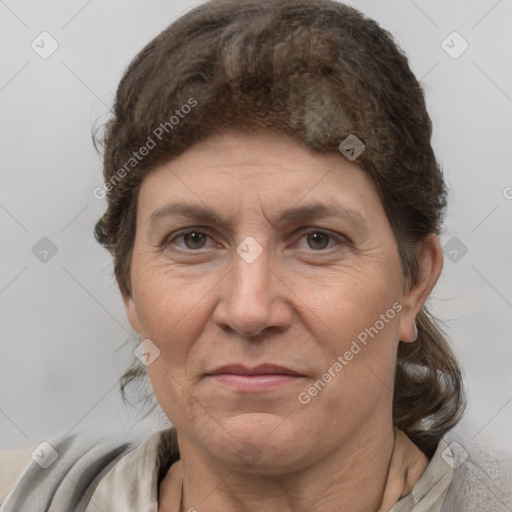 Joyful white adult female with medium  brown hair and grey eyes