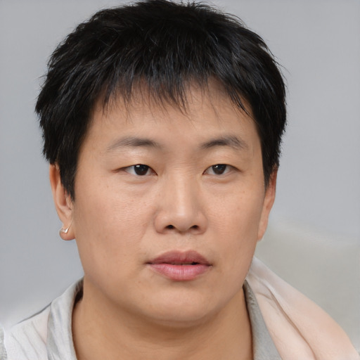 Neutral asian young-adult male with short  brown hair and brown eyes