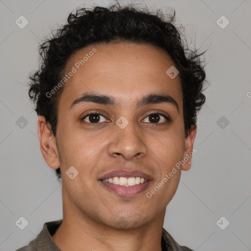 Joyful latino young-adult male with short  brown hair and brown eyes