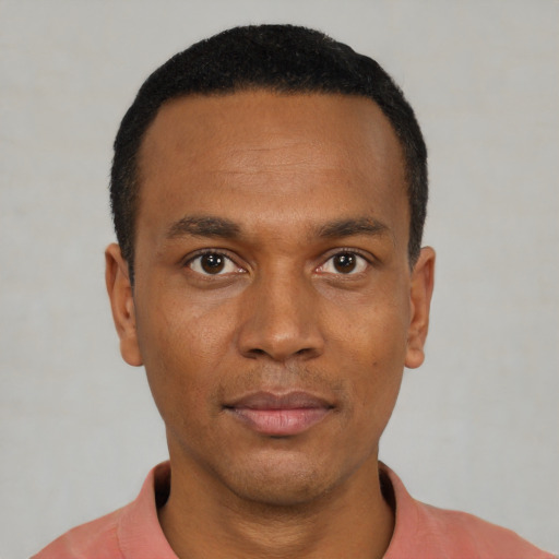Neutral black young-adult male with short  black hair and brown eyes