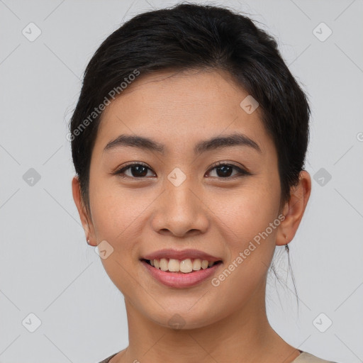 Joyful asian young-adult female with short  brown hair and brown eyes