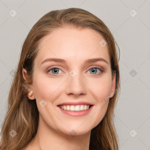 Joyful white young-adult female with long  brown hair and blue eyes