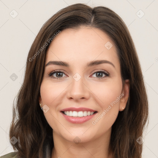 Joyful white young-adult female with long  brown hair and brown eyes