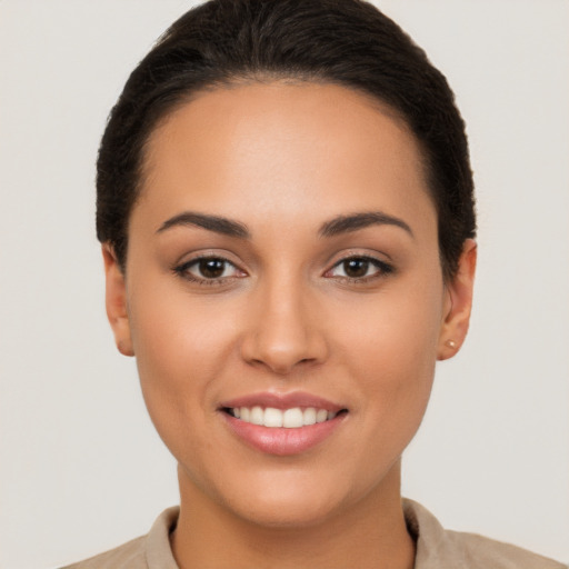 Joyful white young-adult female with short  brown hair and brown eyes