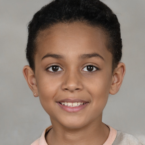 Joyful latino child female with short  brown hair and brown eyes
