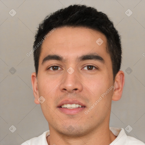 Joyful white young-adult male with short  black hair and brown eyes