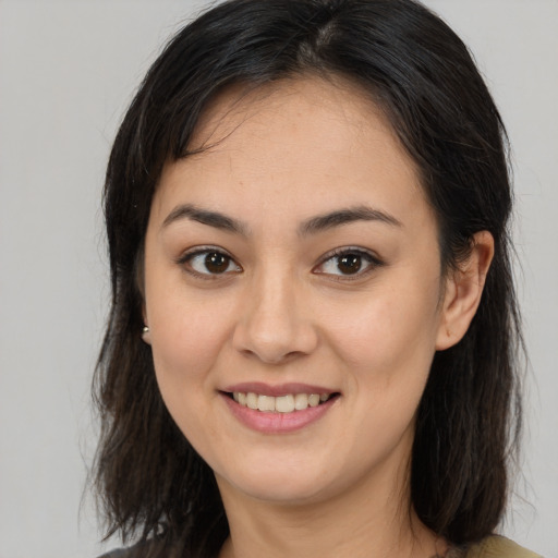Joyful white young-adult female with medium  brown hair and brown eyes