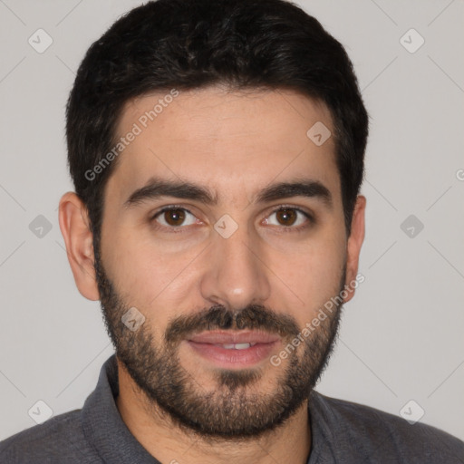 Joyful white young-adult male with short  black hair and brown eyes