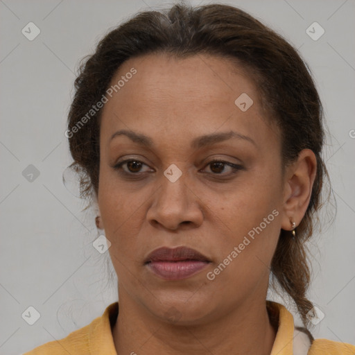 Joyful white adult female with medium  brown hair and brown eyes