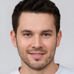 Joyful white young-adult male with short  brown hair and brown eyes