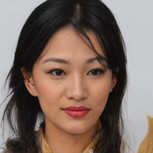 Joyful asian young-adult female with medium  brown hair and brown eyes