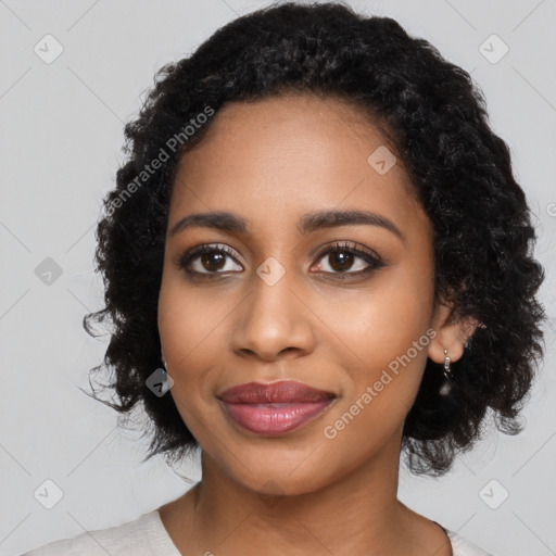 Joyful black young-adult female with medium  black hair and brown eyes