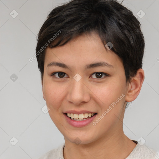 Joyful asian young-adult female with short  brown hair and brown eyes