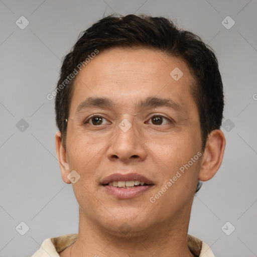 Joyful white adult male with short  brown hair and brown eyes