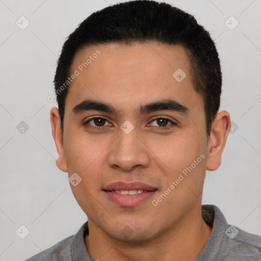 Joyful latino young-adult male with short  brown hair and brown eyes