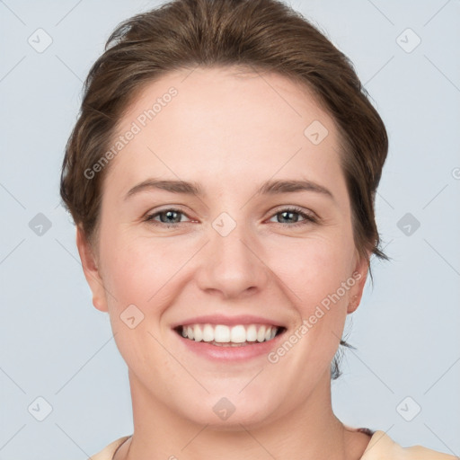 Joyful white young-adult female with short  brown hair and grey eyes