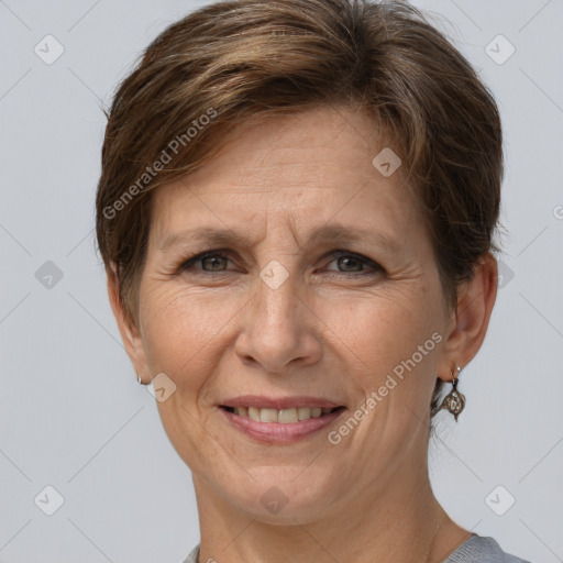 Joyful white adult female with short  brown hair and grey eyes