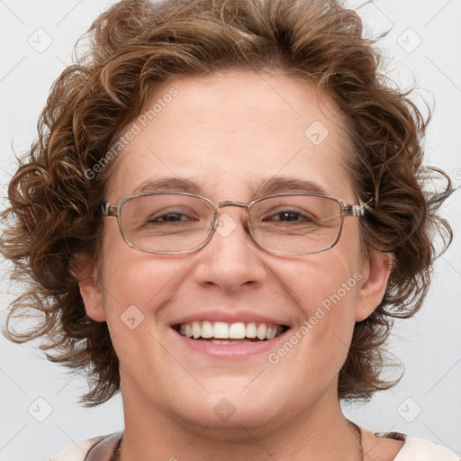 Joyful white adult female with medium  brown hair and blue eyes