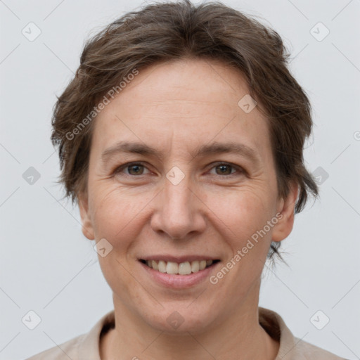 Joyful white adult female with short  brown hair and brown eyes