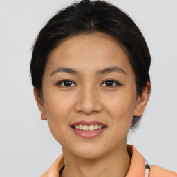 Joyful asian young-adult female with short  brown hair and brown eyes