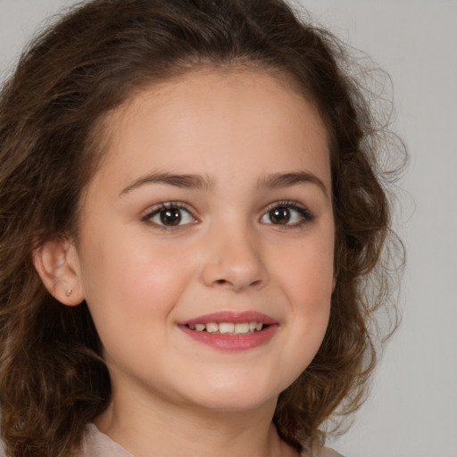 Joyful white child female with medium  brown hair and brown eyes