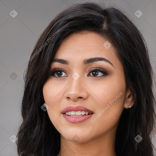 Joyful latino young-adult female with long  brown hair and brown eyes