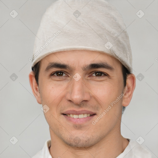 Joyful white young-adult male with short  black hair and brown eyes