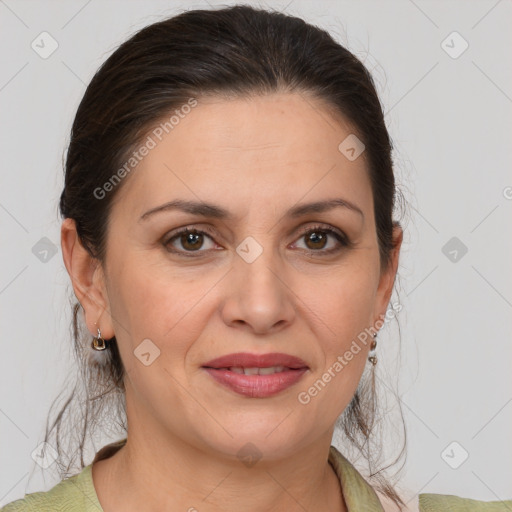 Joyful white adult female with medium  brown hair and brown eyes