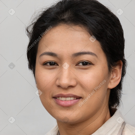 Joyful latino young-adult female with short  brown hair and brown eyes