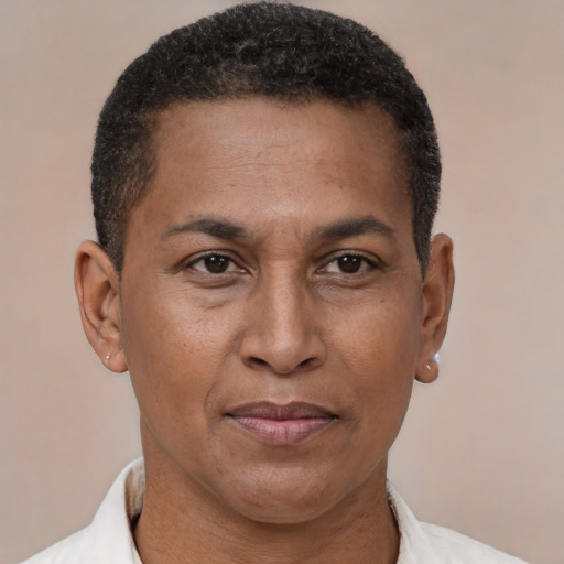 Joyful latino adult male with short  brown hair and brown eyes