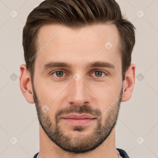 Joyful white young-adult male with short  brown hair and grey eyes