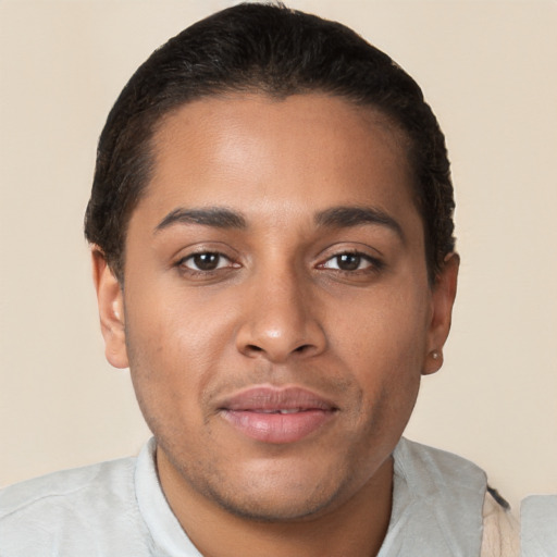 Joyful latino young-adult male with short  brown hair and brown eyes