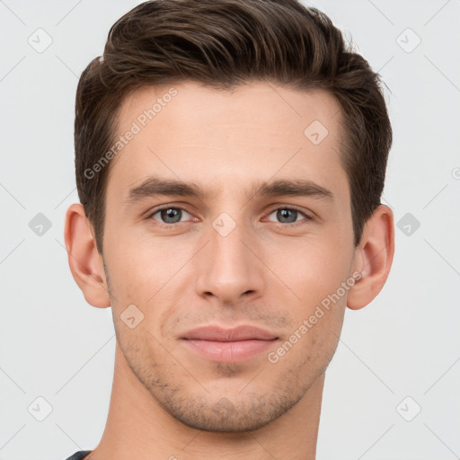 Joyful white young-adult male with short  brown hair and grey eyes