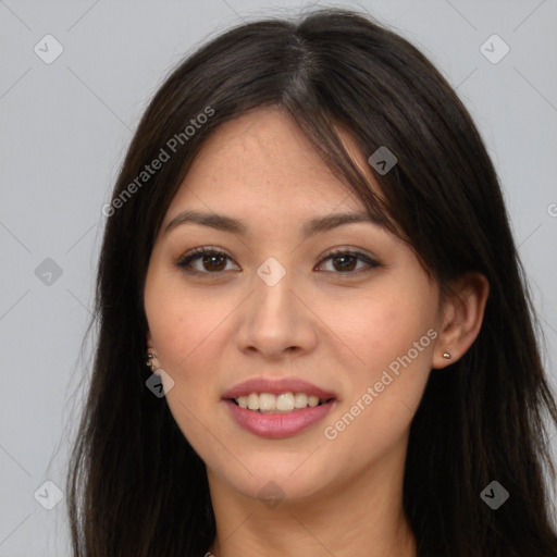 Joyful asian young-adult female with long  brown hair and brown eyes