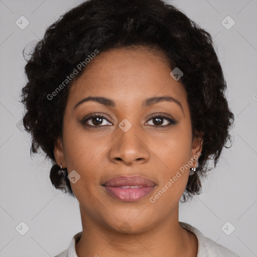 Joyful black adult female with medium  brown hair and brown eyes