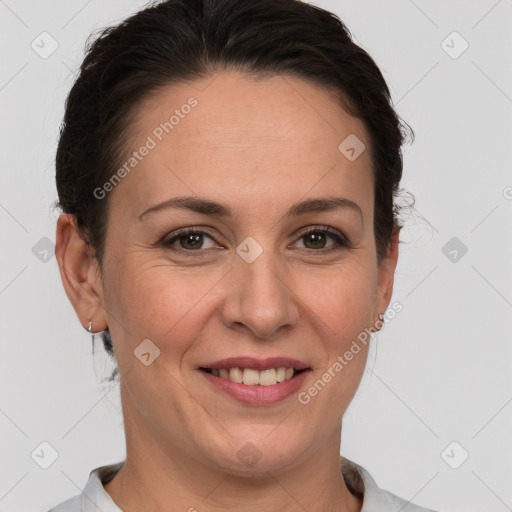 Joyful white adult female with short  brown hair and brown eyes