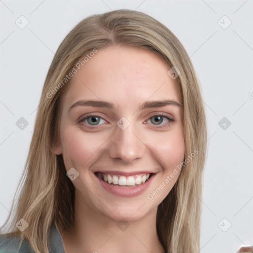 Joyful white young-adult female with long  brown hair and blue eyes