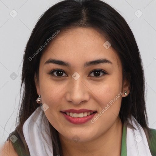 Joyful latino young-adult female with long  brown hair and brown eyes