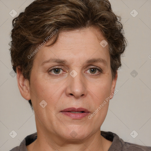 Joyful white adult female with short  brown hair and grey eyes