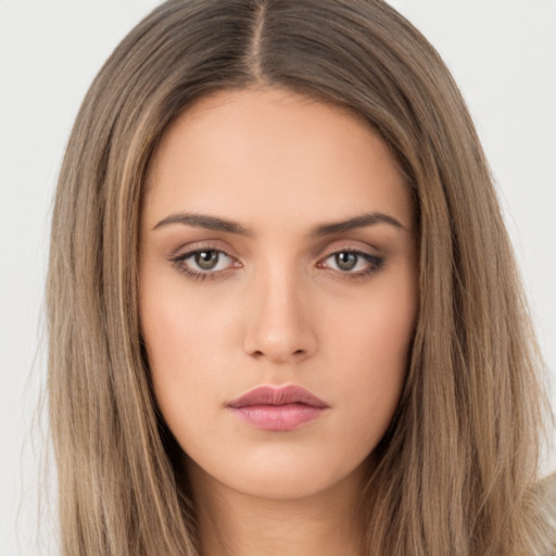 Neutral white young-adult female with long  brown hair and brown eyes